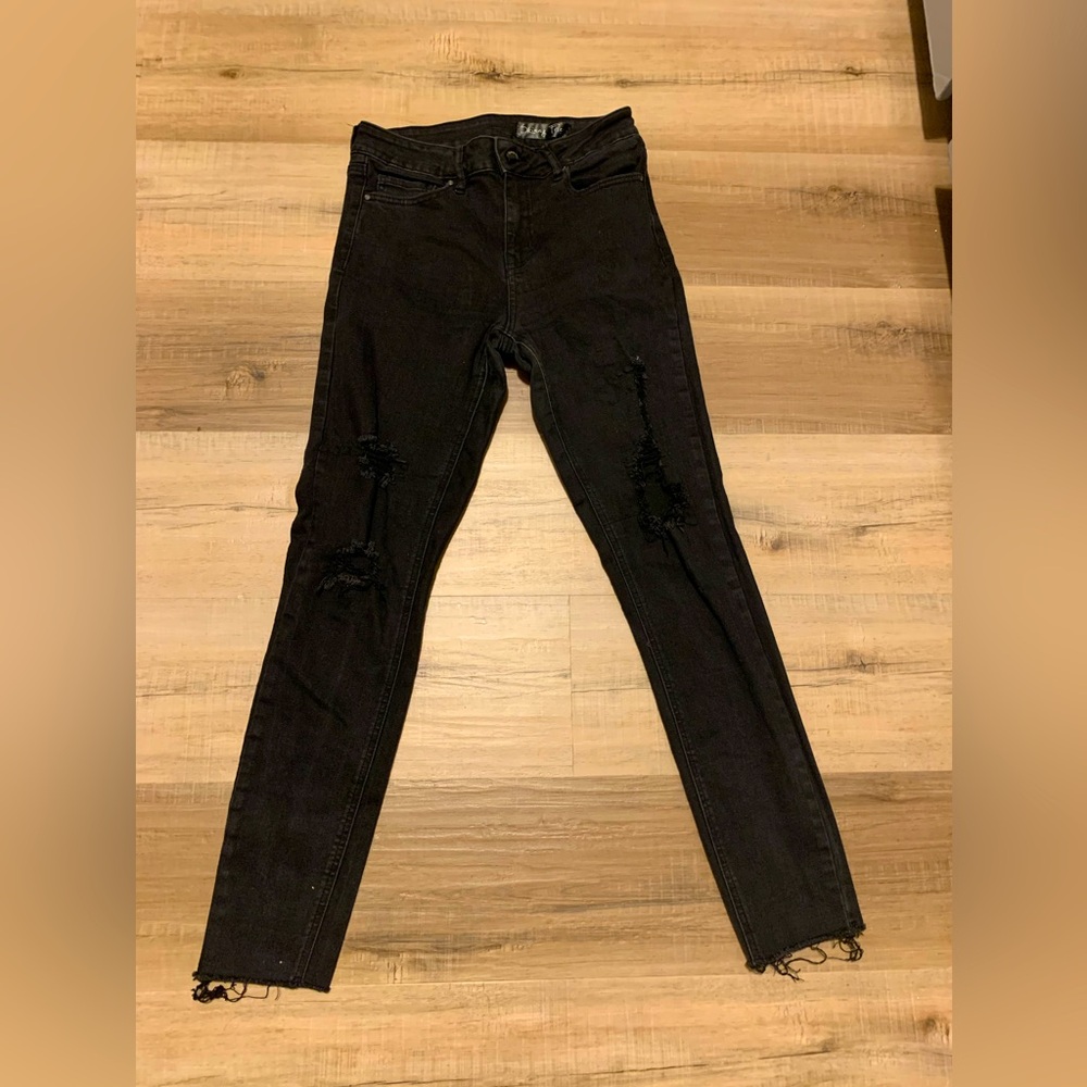 Skinny Fries ripped denim black juniors skinny jeans.